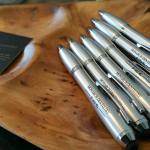 Photo of waiting room amenities, including pens and business cards